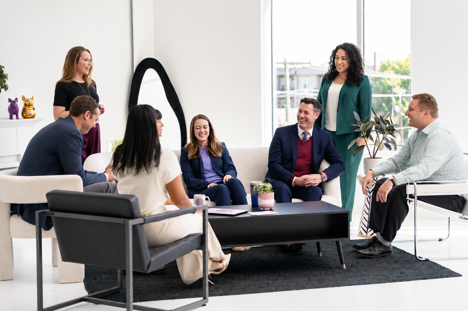 Villmer Caudill attorneys and team members gathered in a bright office lounge for a collaborative conversation.
