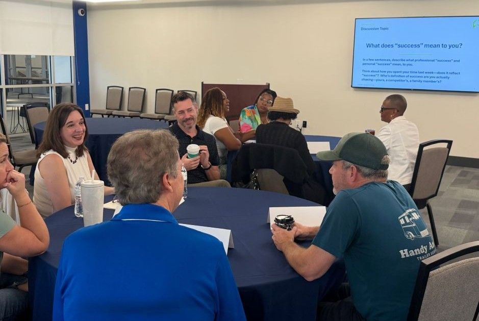 Entrepreneurs in discussion at a round table